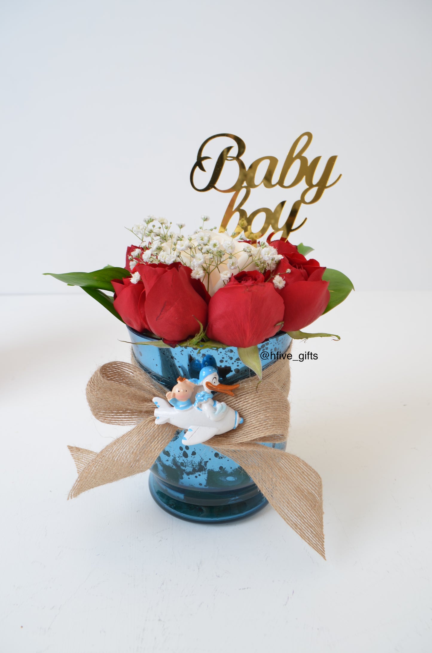 Baby boy fresh flower arrangement in blue vase. Montreal flower delivery